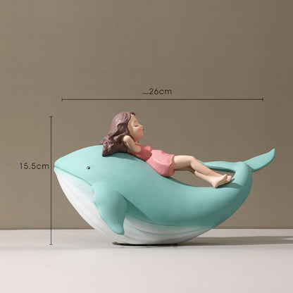 Balene azzurre con bambine sedute