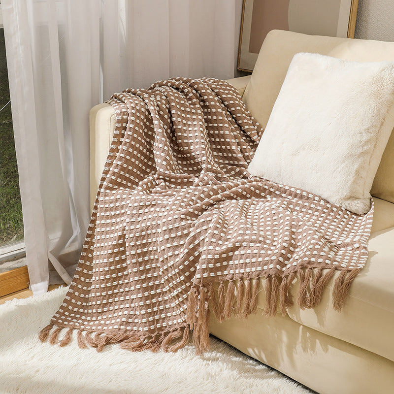 Coperta in lana con nappine