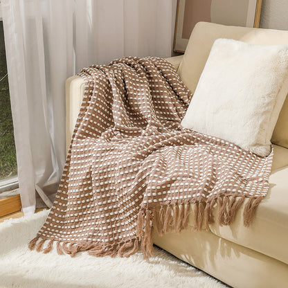 Coperta in lana con nappine