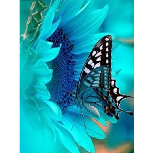Quadro su tela Farfalla su fiore blu