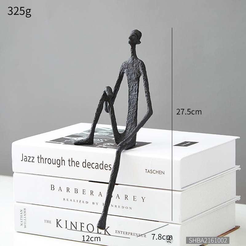 Scultura ferro uomo seduto