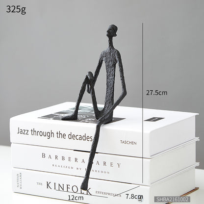 Scultura ferro uomo seduto