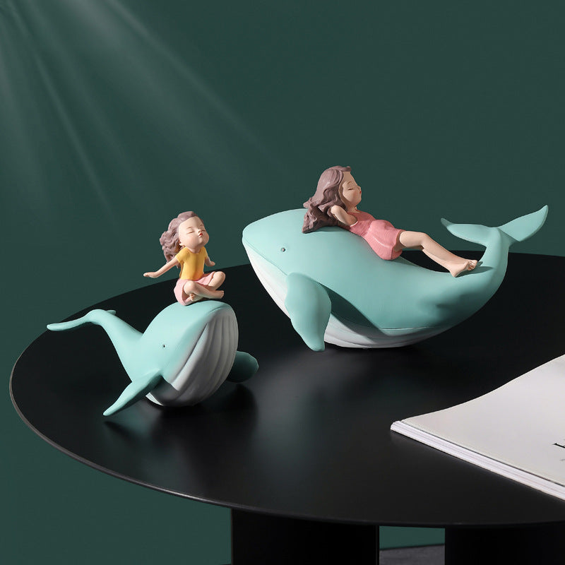 Balene azzurre con bambine sedute
