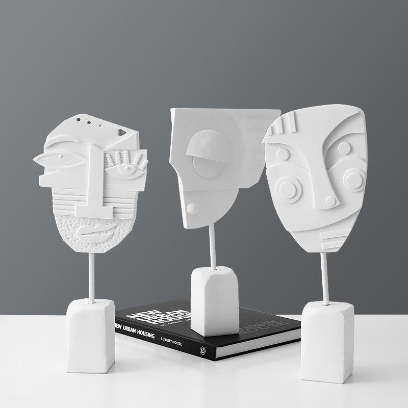 Scultura volto e fiore