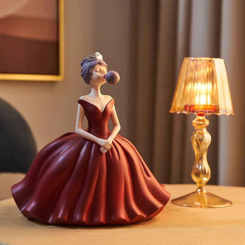 Statuina ragazza soffia bolle