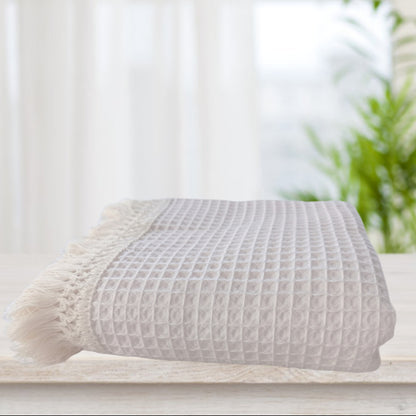 Coperta con nappine