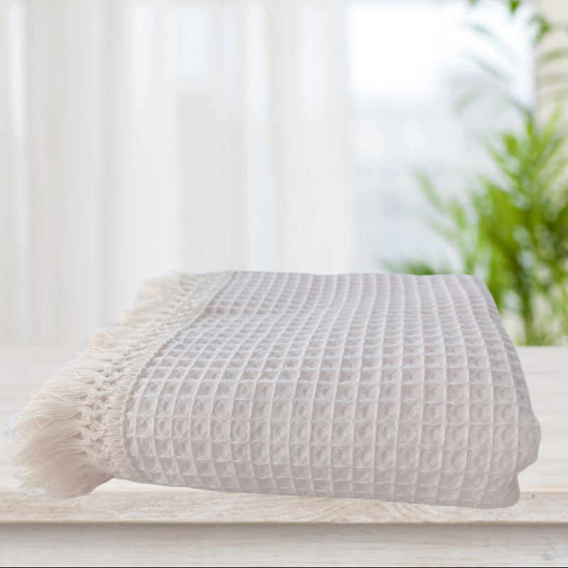 Coperta con nappine