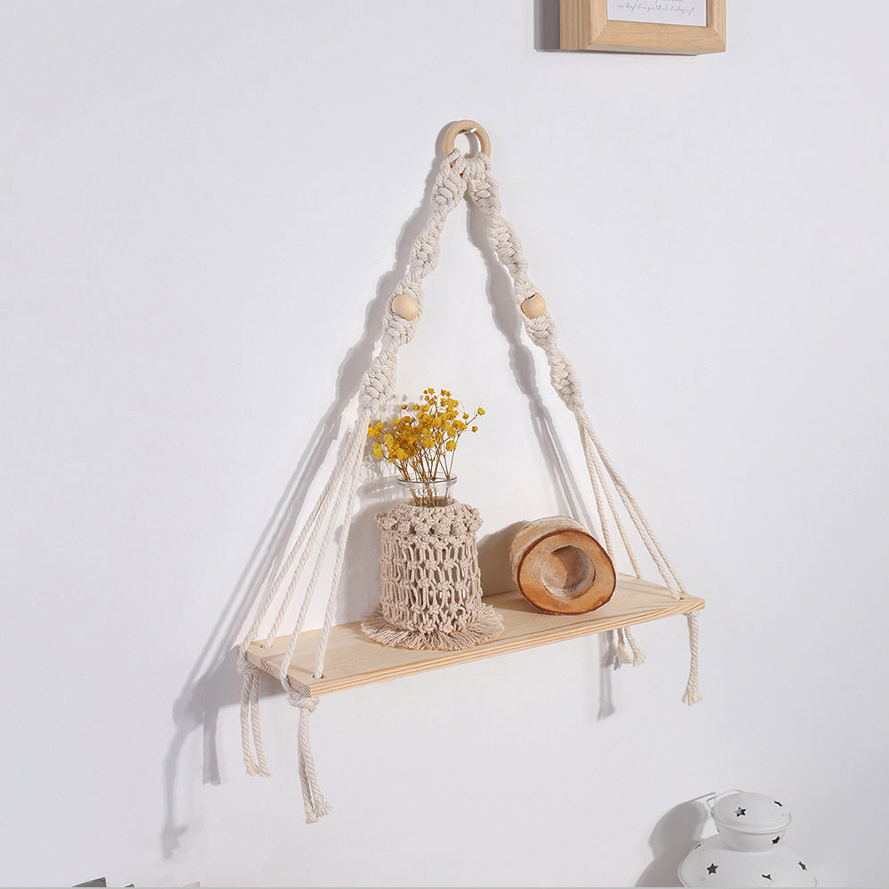 Arazzo tessuto con nappe