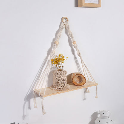 Arazzo tessuto con nappe