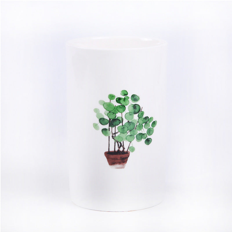 Tazze bianche con piante disegnate