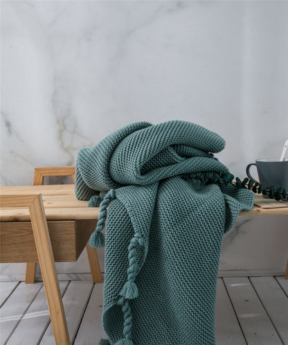 Coperta maglia con nappe
