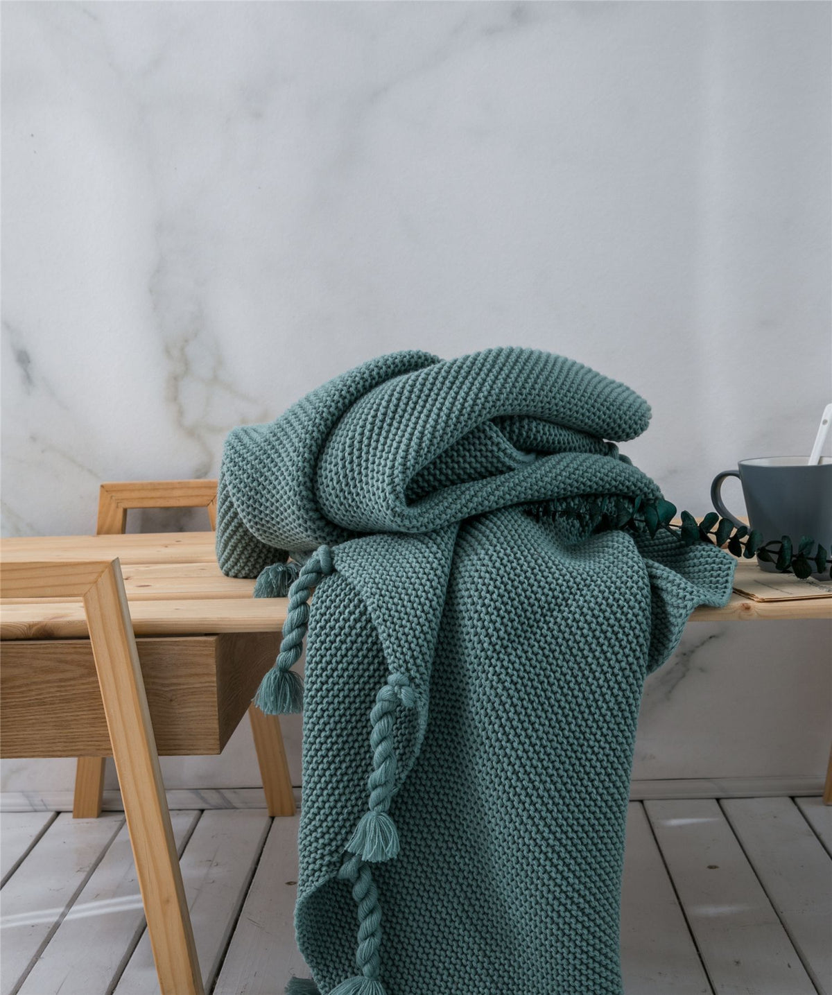 Coperta maglia con nappe