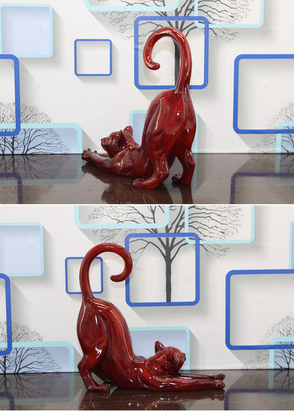 Gatto ceramica rosso disteso