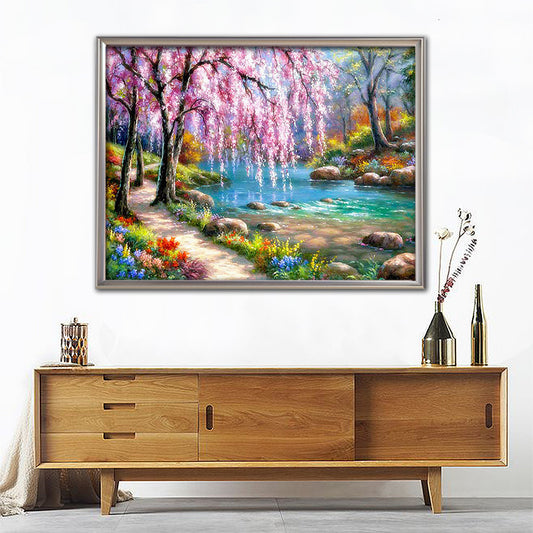 Quadro su tela Ciliegio rosa su ruscello con fiori