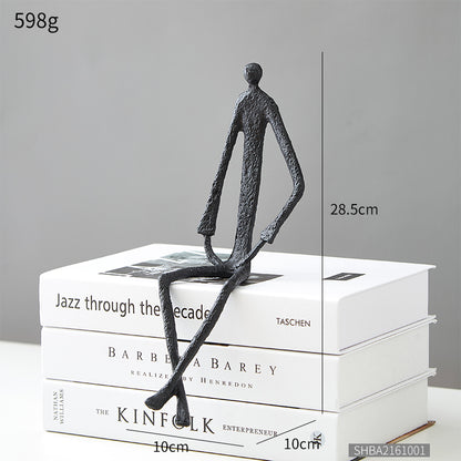 Scultura ferro uomo seduto