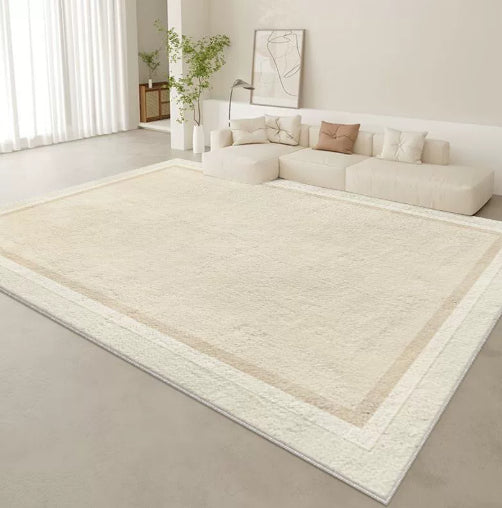 Tappeto beige con bordo bianco