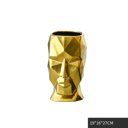 Vaso volto dorato