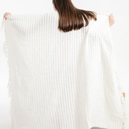 Coperta in lana con nappine