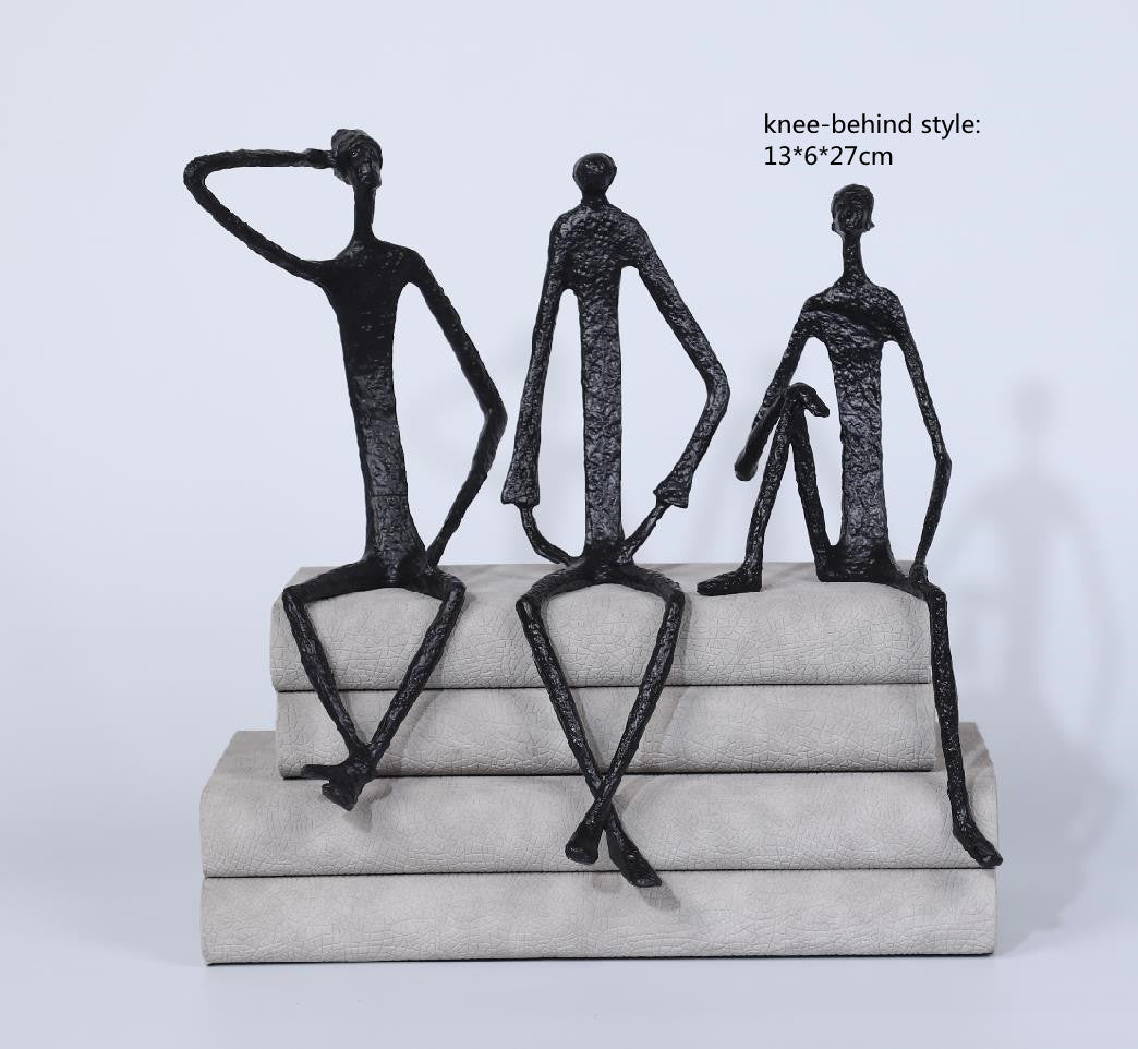 Scultura ferro uomo seduto
