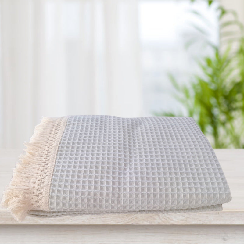 Coperta con nappine