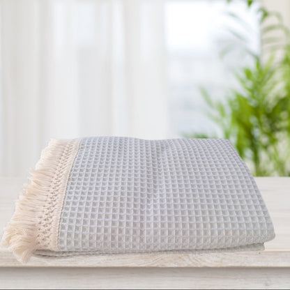 Coperta con nappine