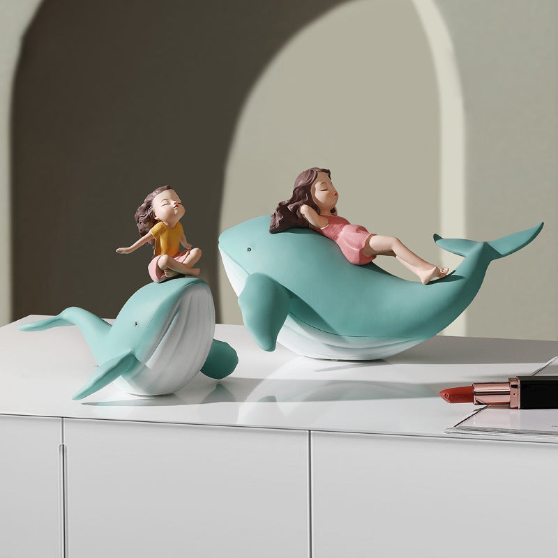Balene azzurre con bambine sedute