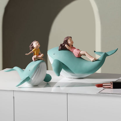 Balene azzurre con bambine sedute