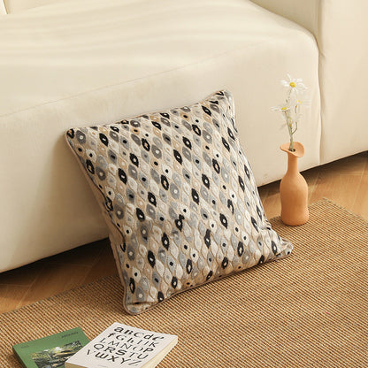 Copricuscino beige con motivo floreale