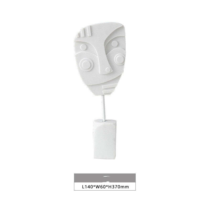 Scultura volto e fiore