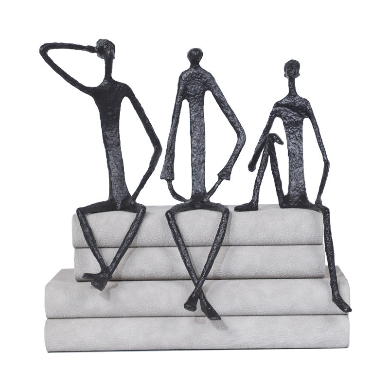 Scultura ferro uomo seduto