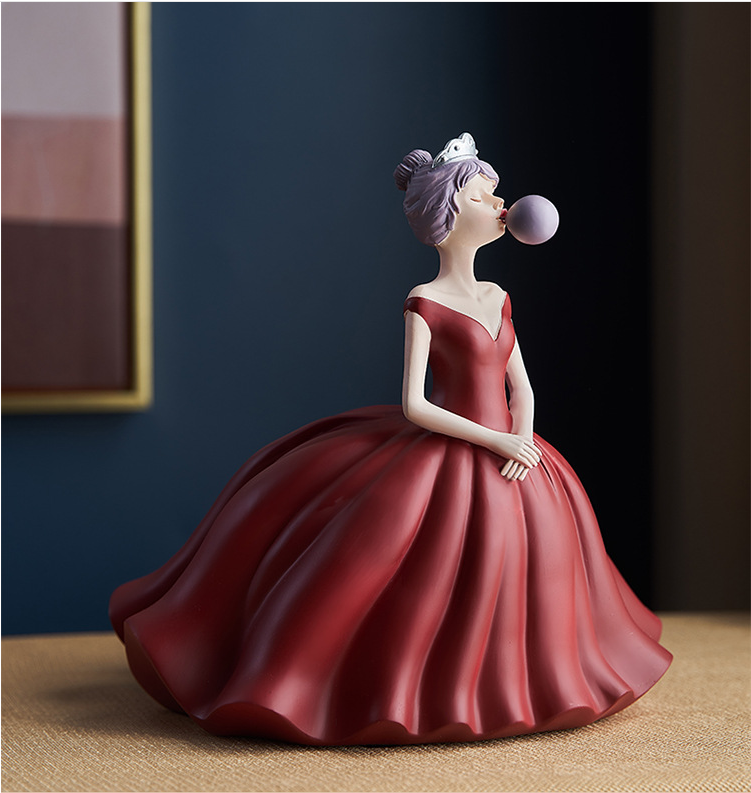 Statuina ragazza soffia bolle