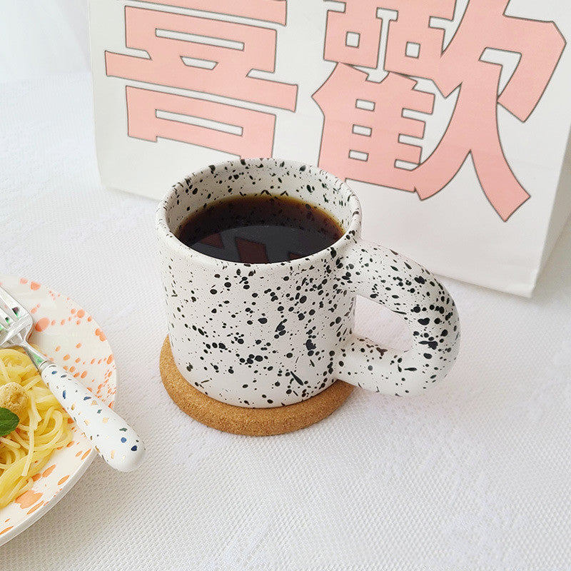 Tazza con inchiostro sparso