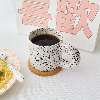 Tazza con inchiostro sparso